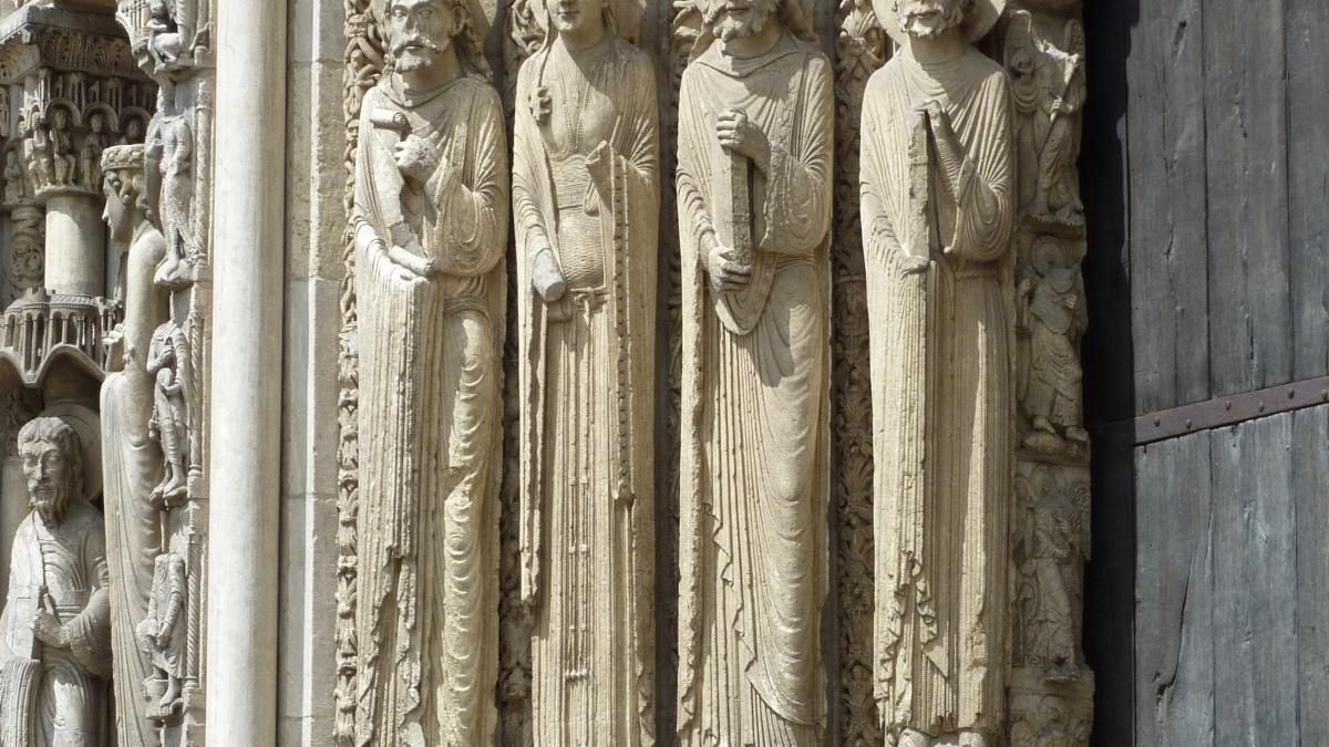 Carvings of figures on the side of a building